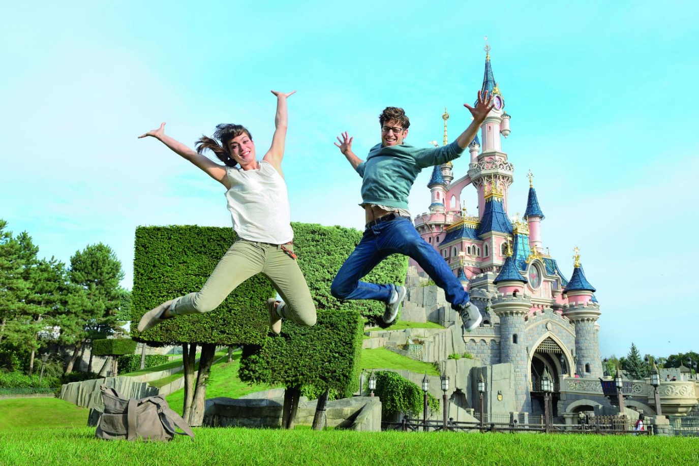 Couples jumping Infront of Disneyland Paris